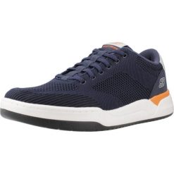 Buty SKECHERS 210793S Niebieski. Niebieskie buty sportowe na co dzień męskie Skechers, z gumy, bez zapięcia. W wyprzedaży za 303.35 zł.
