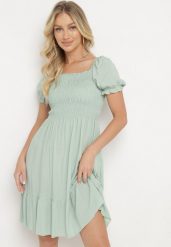 Zielona Sukienka z Bawełny z Elastycznym Dekoltem i Falbanką Loridia. Zielone sukienki damskie Born2be, na co dzień, m, bez wzorów, z bawełny, eleganckie, bez kołnierzyka, bez ramiączek, mini. W wyprzedaży za 47.99 zł.