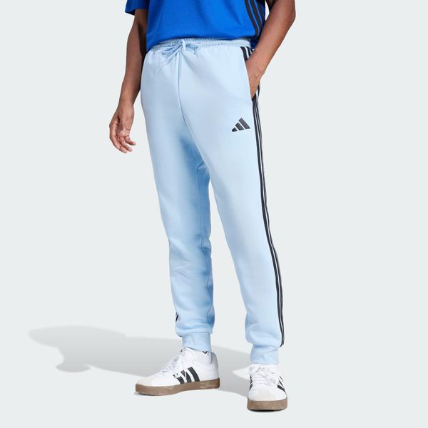 Spodnie Essentials 3-Stripes Fleece. Białe spodnie sportowe męskie Adidas, z bawełny. Za 221.85 zł.