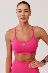 Stanik sportowy bezszwowy Rough Radical Seamless Glow Bra. Fioletowe biustonosze sportowe damskie ROUGH RADICAL, bez wzorów, z dzianiny. Za 129.90 zł.