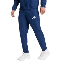 Spodnie męskie adidas Entrada 26 Presentation. Niebieskie spodnie materiałowe męskie Adidas, bez wzorów, z materiału, sportowe. Za 121.99 zł.