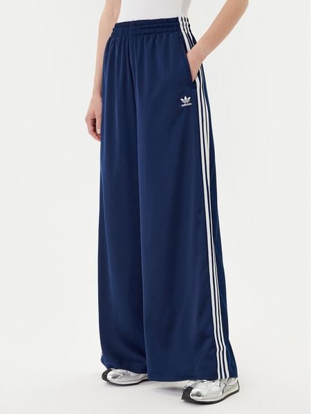 Adidas Spodnie dresowe adicolor Satin JD0881 Granatowy Wide Leg. Niebieskie spodnie dresowe damskie Adidas, bez wzorów, z dresówki. Za 279.99 zł.