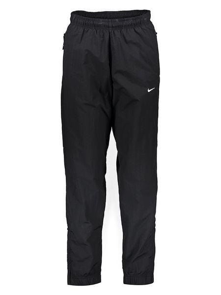 Nike Spodnie "NRG Woven" w kolorze czarnym do biegania rozmiar: XS. Czarne spodnie materiałowe męskie Nike, bez wzorów, ze skóry. Za 152.98 zł.