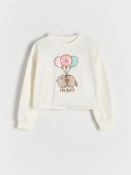 Bawełniana koszulka Pusheen - złamana biel. Koszulki dziewczęce Reserved, bez wzorów, z bawełny, bez ramiączek. Za 59.99 zł.