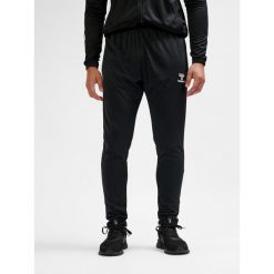 SPODNIE hmlESSENTIAL TRAINING PANTS. Czarne spodnie dresowe damskie HUMMEL, m, z dresówki, do piłki nożnej. Za 100.00 zł.