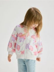 Bluza w kwiaty - złamana biel. Bluzy i bluzki niemowlęce Reserved, bez wzorów, z bawełny, bez ramiączek, bez kaptura. W wyprzedaży za 29.99 zł.