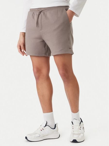 Tommy Jeans Szorty sportowe DM0DM21931 Beżowy Regular Fit. Brązowe szorty męskie Tommy Jeans, bez wzorów, z bawełny, sportowe. Za 189.99 zł.