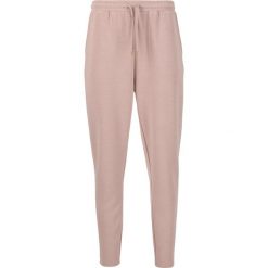 Damskie spodnie dresowe Athlecia Jacey V2. Czerwone spodnie dresowe damskie Athlecia, bez wzorów, z dresówki. Za 189.50 zł.