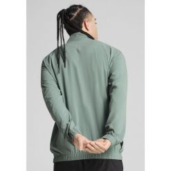 Męska kurtka do biegania VELOCITY PUMA Green Moon. Zielone kurtki treningowe męskie Puma, m, bez wzorów, do biegania. W wyprzedaży za 169.00 zł.