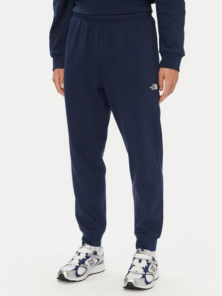 The North Face Spodnie dresowe Evolution Simple Dome NF0A8CWY Granatowy Regular Fit. Niebieskie spodnie dresowe męskie The North Face, bez wzorów, z bawełny. Za 279.99 zł.