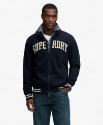 Superdry Vintage Athletic kurtka dresowa luźny krój. Niebieskie kurtki damskie Superdry., xl, z aplikacjami, z bawełny, bez kaptura. Za 408.75 zł.