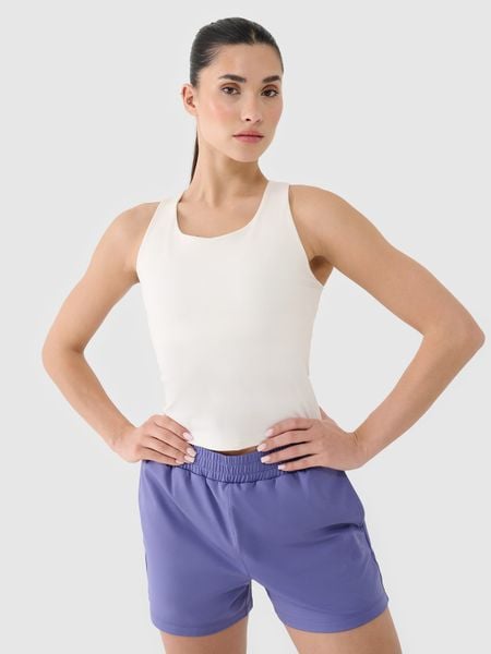 4F Crop-top treningowy szybkoschnący damski - biały XL. Białe topy damskie 4f, xl, bez wzorów, z dzianiny, bez kołnierzyka. W wyprzedaży za 59.99 zł.