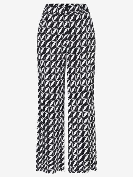 More & More Spodnie w kolorze czarno-białym rozmiar: 44. Białe spodnie materiałowe damskie MORE & MORE, bez wzorów, z materiału, z podwyższonym stanem. Za 109.00 zł.