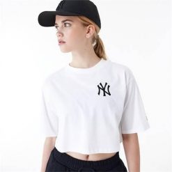 Koszulka sportowa damska New Era Neyyan. Białe bluzki sportowe damskie New Era, s, bez wzorów, z bawełny, bez ramiączek. Za 275.00 zł.