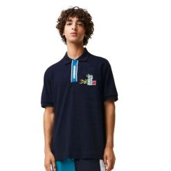 Koszulka sportowa polo męska Lacoste Polo. Niebieskie koszulki polo męskie Lacoste, m, z aplikacjami, z bawełny, bez ramiączek. Za 397.00 zł.