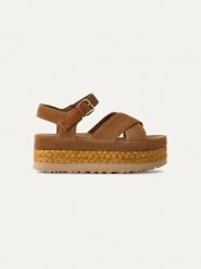 UGG Skórzane sandały "Aubrey" w kolorze jasnobrązowym rozmiar: 38. Brązowe sandały damskie Ugg, bez wzorów, ze skóry, bez obcasa, na koturnie. Za 549.06 zł.