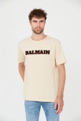 BALMAIN Beżowy t-shirt Retro Balmain Flock. Brązowe t-shirty męskie Balmain, m, bez wzorów, bez kołnierzyka. W wyprzedaży za 1,299.99 zł.