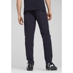 Męskie spodnie Casuals Manchester City PUMA New Navy Magic Blue. Niebieskie spodnie dresowe męskie Puma, bez wzorów, z dresówki. W wyprzedaży za 139.00 zł.
