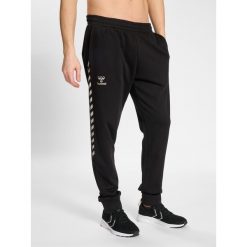 Jogging w bawełnie Hummel HmlStaltic. Czarne spodnie dresowe męskie HUMMEL, bez wzorów, z bawełny, sportowe. Za 170.00 zł.