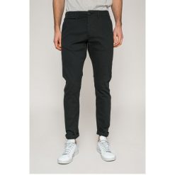 Produkt by Jack & Jones - Spodnie. Zielone spodnie materiałowe męskie PRODUKT by Jack & Jones, bez wzorów, z bawełny, casualowe. W wyprzedaży za 69.90 zł.