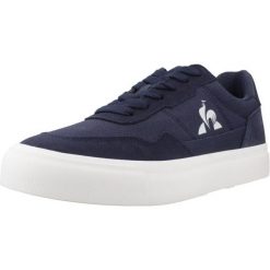 Buty LE COQ SPORTIF LCS OLLIE Niebieski. Niebieskie buty trekkingowe męskie Le Coq Sportif, ze skóry, bez zapięcia, trekkingowe. Za 228.99 zł.