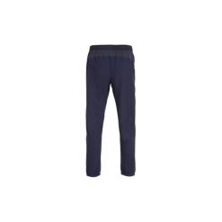Spodnie fitness kardio męskie FPA 500 granatowe. Niebieskie spodnie sportowe męskie DOMYOS, z elastanu. Za 79.99 zł.