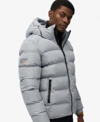 Superdry Pikowana kurtka sportowa z kapturem z recyklingowanego poliestru. Niebieskie kurtki treningowe męskie Superdry., xl, bez wzorów, z materiału. Za 559.35 zł.