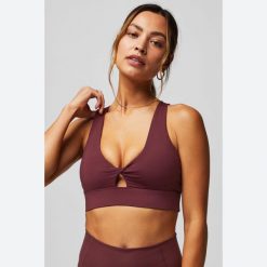 Biustonosz dla kobiet Fabletics Oasis Twist. Niebieskie biustonosze FABLETICS, bez wzorów, z elastanu. Za 269.00 zł.