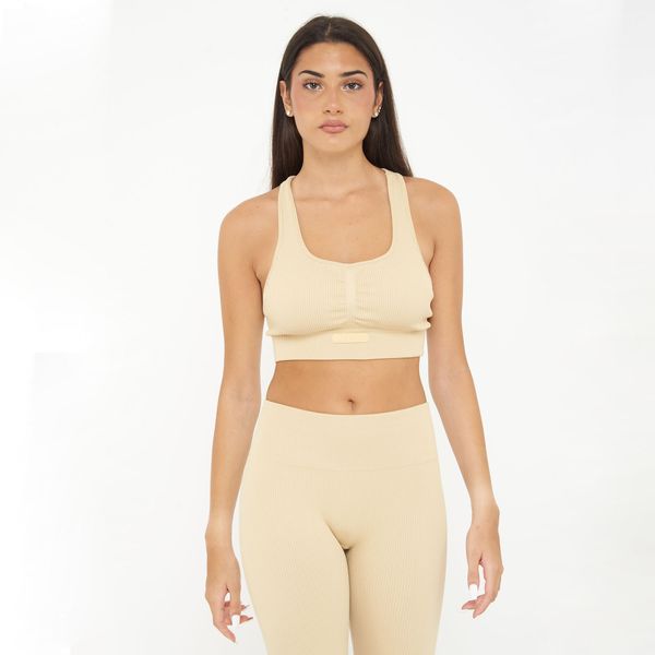 Crop top treningowy ICONIC. Brązowe topy sportowe damskie Legea, xl, bez wzorów, z elastanu, bez ramiączek. W wyprzedaży za 90.00 zł.
