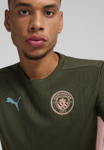 Męska koszulka treningowa Manchester City PUMA Myrtle Bold Blue Green. Niebieskie t-shirty sportowe męskie Puma, m, z żakardem, bez ramiączek, na fitness i siłownię. Za 229.80 zł.