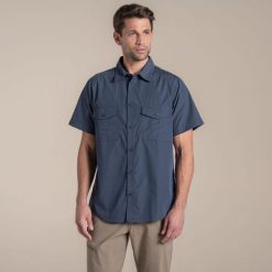 Koszula Craghoppers Kiwi II. Niebieskie koszule męskie CRAGHOPPERS, m, bez wzorów, bez kołnierzyka, bez ramiączek. Za 214.10 zł.