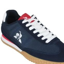 Tenisówki Le Coq Sportif Model Veloce I Kolor Niebieski. Niebieskie trampki i tenisówki męskie Le Coq Sportif, bez wzorów, z tkaniny, bez zapięcia. Za 352.00 zł.