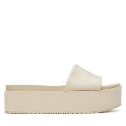 Klapki Calvin Klein Jeans. Klapki damskie Calvin Klein Jeans, bez wzorów, z jeansu, bez obcasa. Za 239.99 zł.
