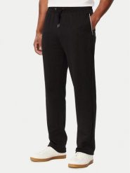 Tommy Hilfiger Spodnie dresowe MW0MW44991 Czarny Regular Fit. Czarne spodnie dresowe męskie Tommy Hilfiger, bez wzorów, z bawełny. Za 529.99 zł.