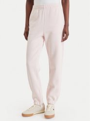 Lacoste Spodnie dresowe XF5244 Różowy jasny Regular Fit. Czerwone spodnie dresowe damskie Lacoste, bez wzorów, z bawełny. Za 639.99 zł.