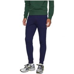 Spodnie Lacoste slim fit z organicznej bawełny granatowe. Niebieskie spodnie sportowe męskie Lacoste, z bawełny. Za 510.45 zł.