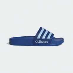 Klapki Adilette Shower. Niebieskie klapki damskie Adidas, bez wzorów, bez obcasa. Za 109.00 zł.