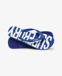 Superdry Klapki Core Logo z gumy, lekkie i wygodne – Regal Blue/Optic. Niebieskie klapki damskie Superdry., bez wzorów, z gumy, bez obcasa. Za 134.40 zł.
