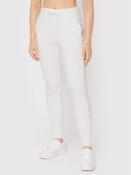 Guess Spodnie dresowe V2YB18 K7UW2 Biały Regular Fit. Białe spodnie dresowe damskie Guess, xs, z aplikacjami, z dresówki. Za 189.99 zł.
