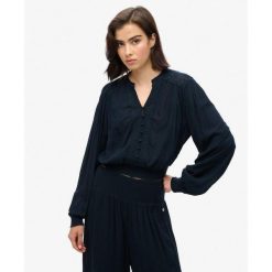 Bluzka z długim rękawem z marszczoną koronką. Niebieskie bielizna termoaktywna damska Superdry., l, bez wzorów, z koronki. Za 282.85 zł.