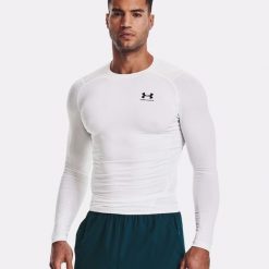 Koszulka fitness męska Under Armour Ua Hg Armour Comp LS z długim rękawem. Białe t-shirty sportowe męskie Under Armour, m, bez ramiączek, do biegania. Za 228.77 zł.