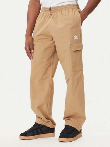 Adidas Spodnie dresowe Trefoil Essentials JX3912 Beżowy Loose Fit. Brązowe spodnie dresowe męskie Adidas, bez wzorów, z bawełny. Za 219.99 zł.