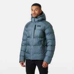 Kurtka z kapturem Helly Hansen Active Winter. Niebieskie kurtki męskie Helly Hansen, bez wzorów, z puchu, sportowe, z kapturem. W wyprzedaży za 1,157.50 zł.