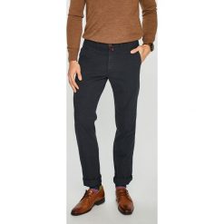 Pierre Cardin - Spodnie Voyage. Niebieskie spodnie materiałowe męskie Pierre Cardin, bez wzorów, z bawełny, casualowe. W wyprzedaży za 279.90 zł.