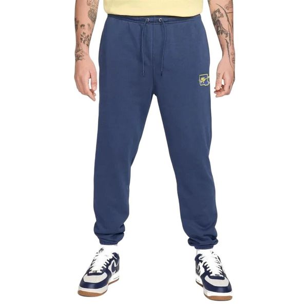 Spodnie Do Joggingu Męskie Club. Niebieskie spodnie materiałowe męskie Nike, bez wzorów, z bawełny. Za 475.99 zł.