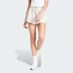 Szorty Essentials French Terry Small Logo. Białe spodenki sportowe damskie Adidas, bez wzorów, z materiału, eleganckie. Za 109.00 zł.