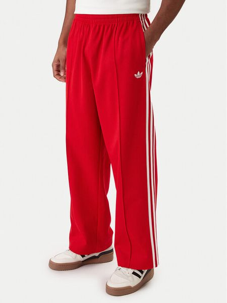 Adidas Spodnie dresowe adicolor KE3498 Czerwony Loose Fit. Czerwone spodnie dresowe męskie Adidas, bez wzorów, z bawełny. Za 279.99 zł.
