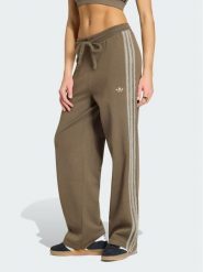 Adidas Spodnie dresowe Firebird KS7362 Brązowy Regular Fit. Brązowe spodnie dresowe damskie Adidas, xs, bez wzorów, z dresówki. Za 314.99 zł.