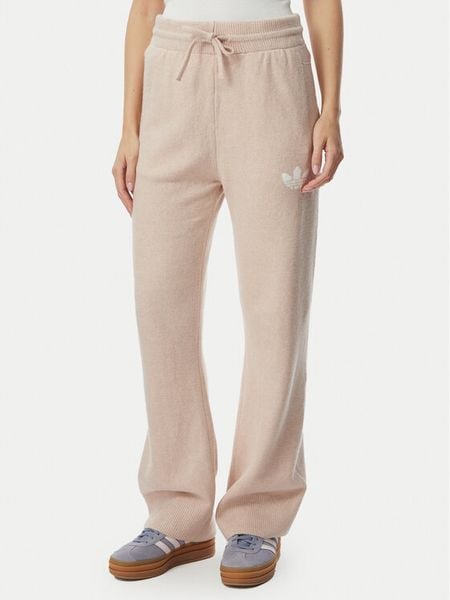 Adidas Spodnie dresowe Essentials KR9180 Beżowy Loose Fit. Brązowe spodnie dresowe damskie Adidas, xs, bez wzorów, z dresówki. Za 299.99 zł.