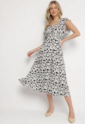 Czarna Bawełniana Sukienka w Kwiatki o Rozkloszowanym Kroju z Gumką Alanilia. Czarne sukienki damskie Born2be, na co dzień, na lato, l, bez wzorów, z bawełny, eleganckie, bez kołnierzyka, bez ramiączek, maxi, kopertowe. W wyprzedaży za 51.99 zł.